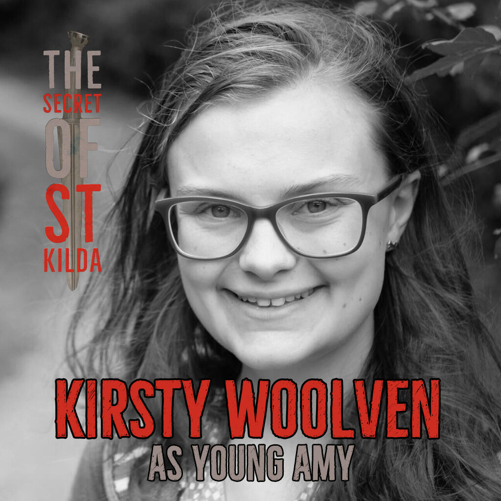 Kirsty Woolven as Young Amy. Smiling black and white headshot of a young white woman with long brown hair and glasses